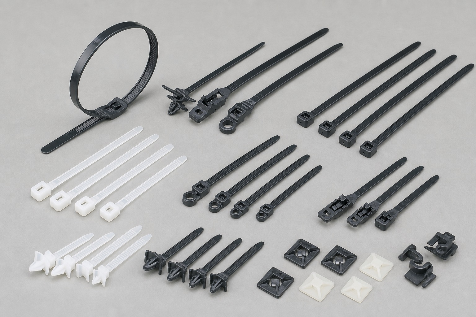 Automotive cable tie kit with standard ties releasable ties mountable ties bases clips and push mount ties