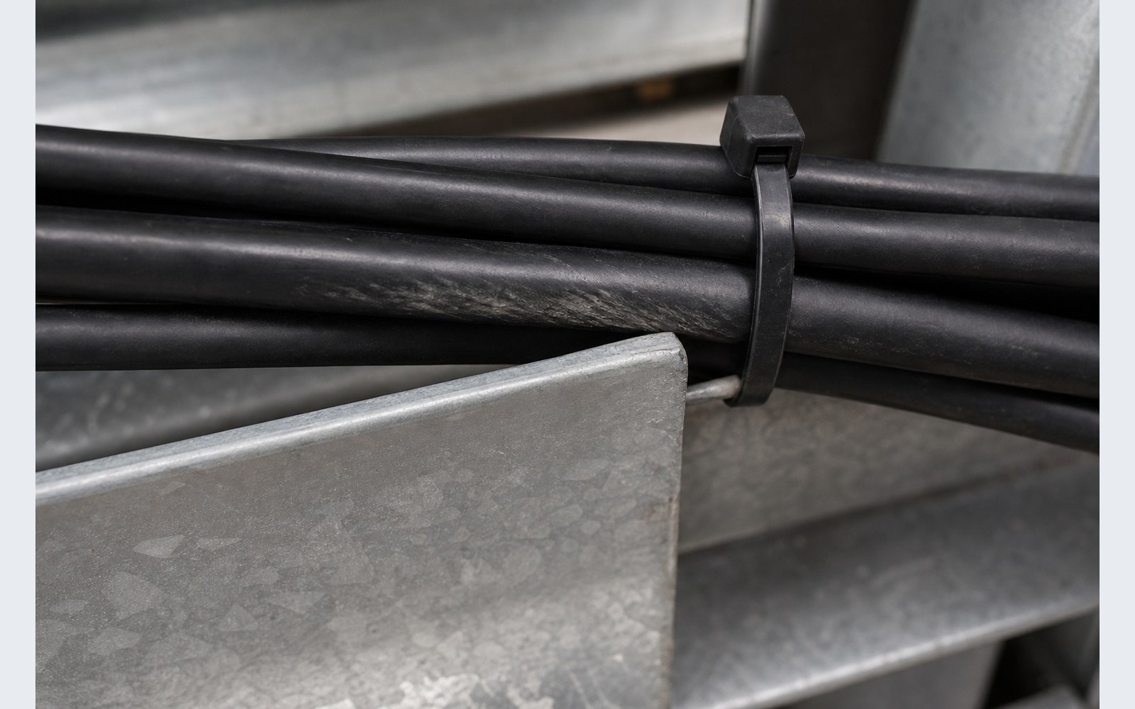 Cable jacket abrasion risk at galvanized tray edge before correction