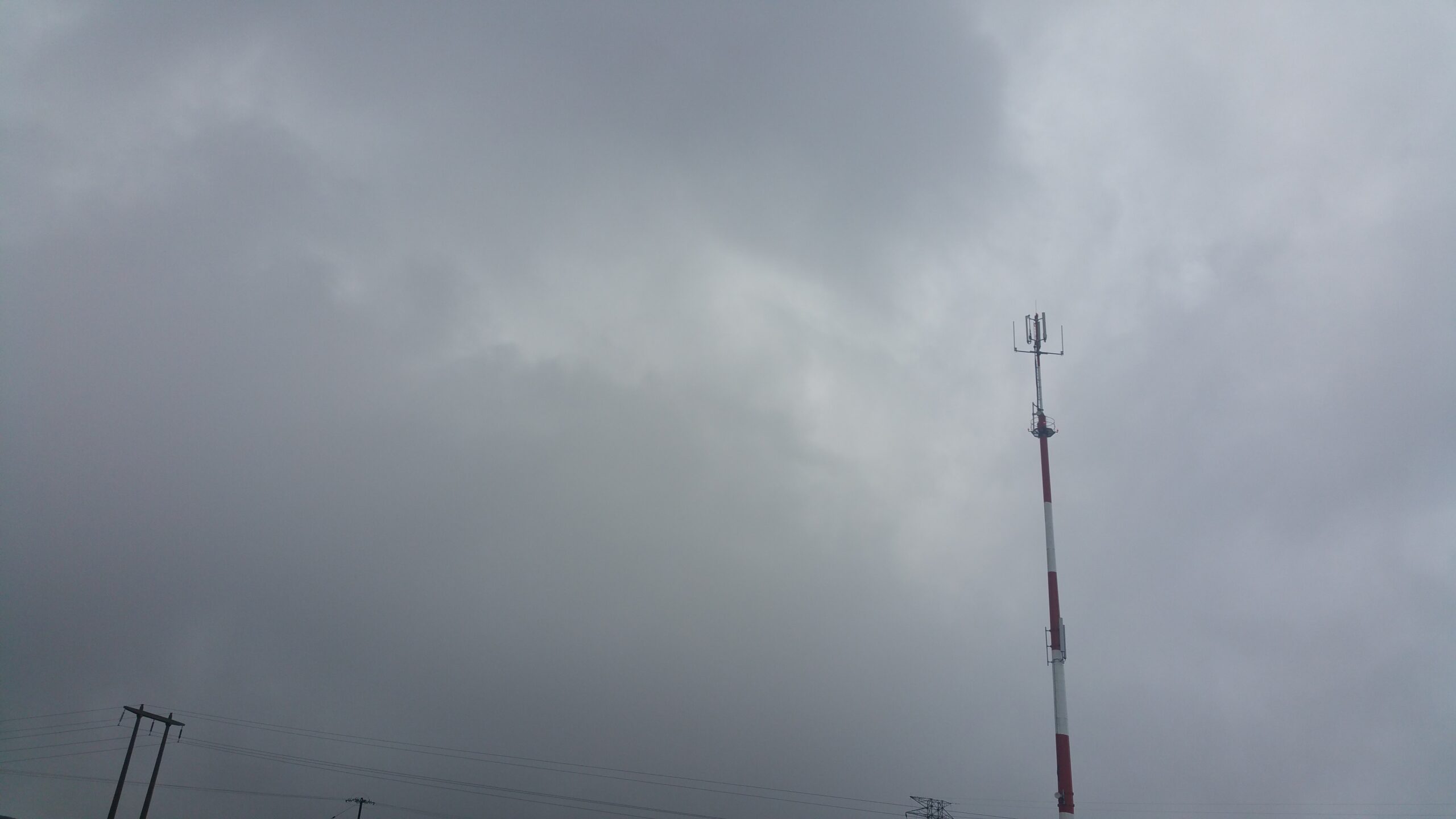Real cellular base station tower for outdoor telecom cable fixing context