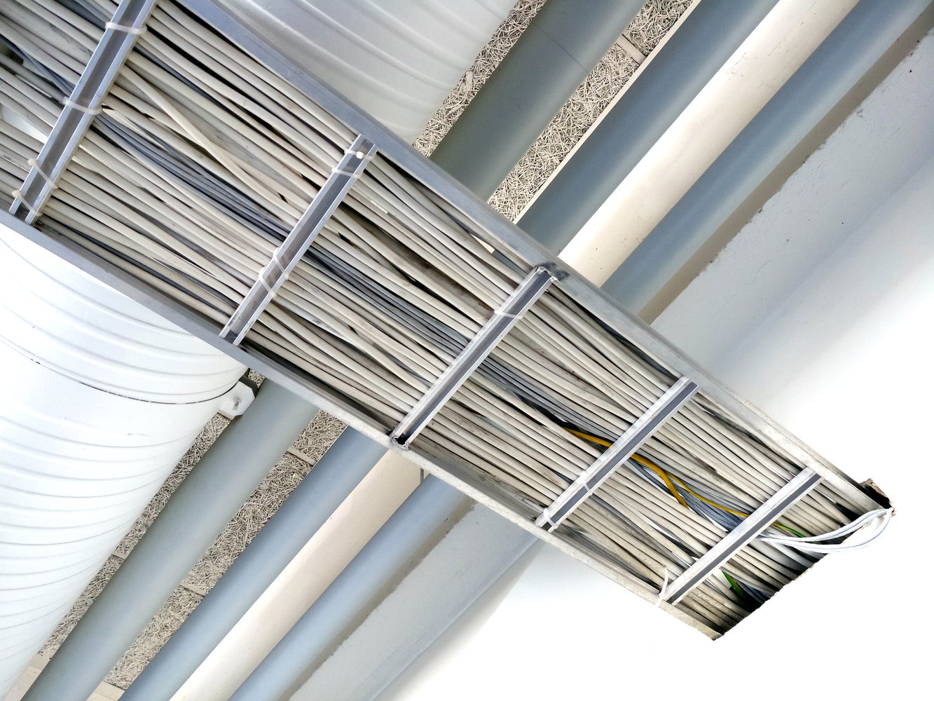 Marine cable tray close-up showing dense cable routing and support points
