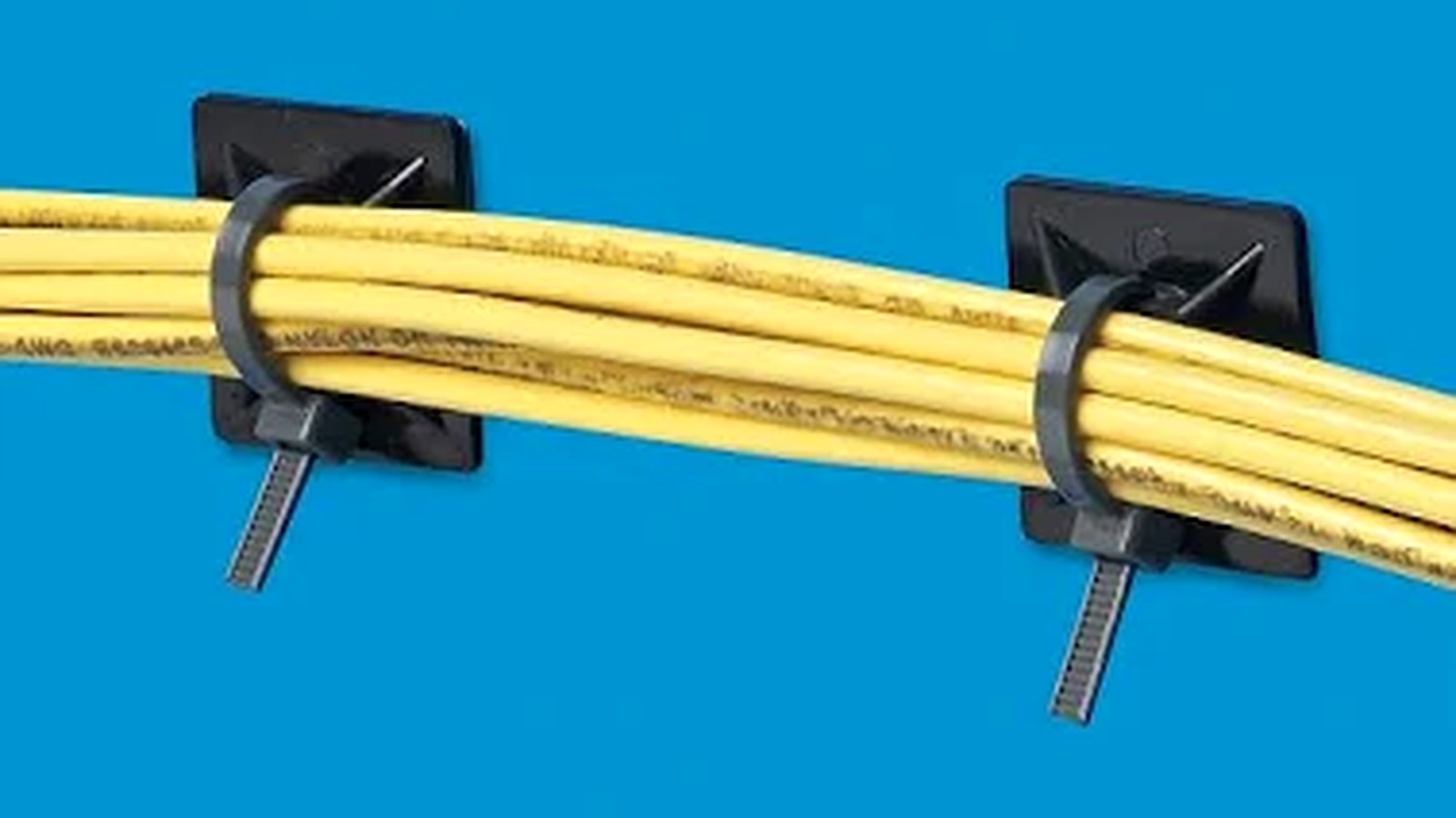 Pipe and conduit fastening demo with cable ties fixed to mounting bases